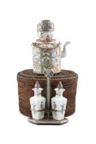 A GROUP OF THREE PORCELAINS, CONSISTING OF A TEAPOT AND CUP IN A WOVEN BOX; A SILVER MOUNTED OIL