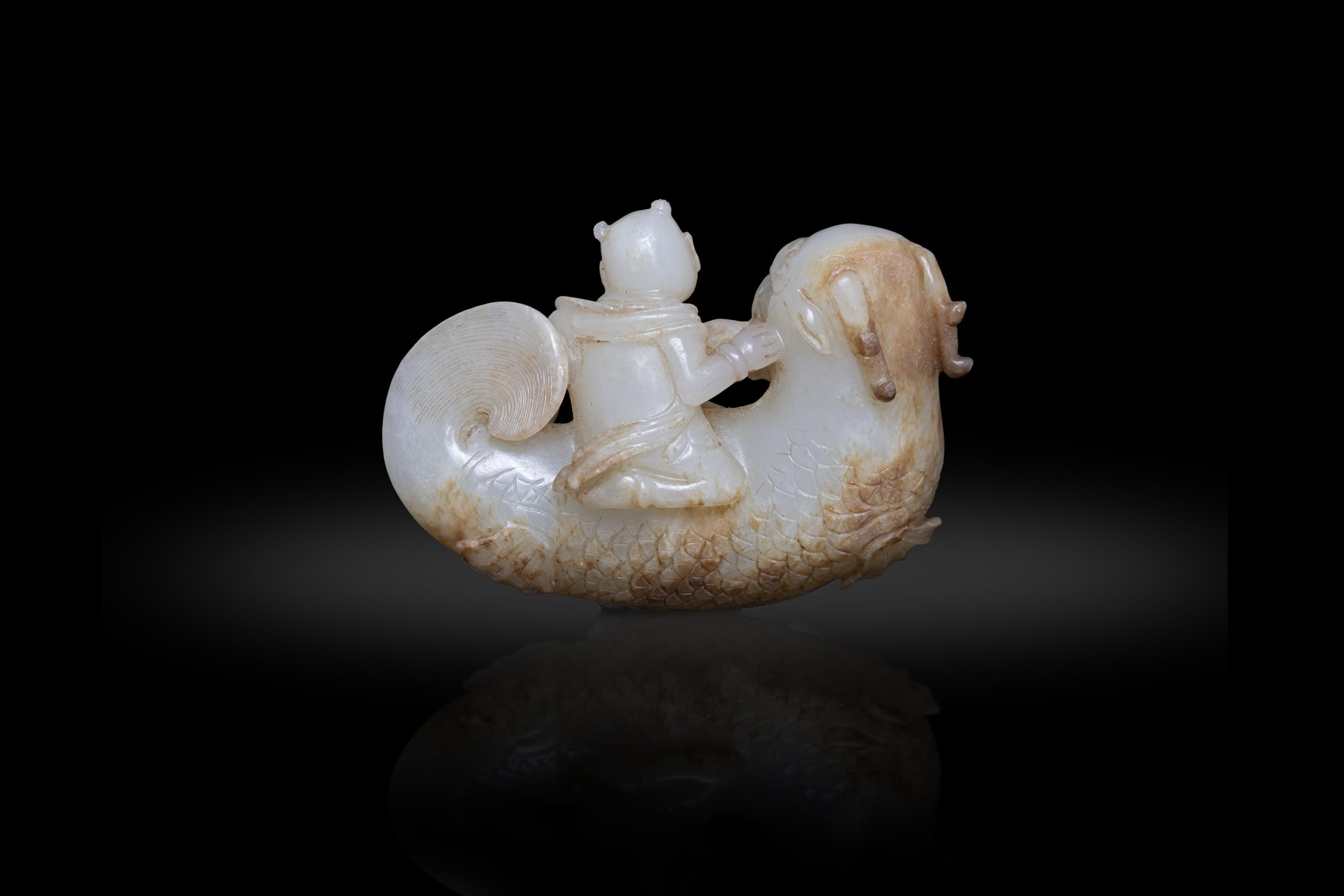A WHITE JADE AND RUSSET 'BOY RIDING THE DRAGON-FISH' GROUP 明代 白玉獨佔鰲頭 China, - Image 2 of 2