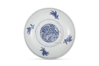 TWO BLUE AND WHITE CHARGERS, ONE FLOWER-SHAPED DECORATED WITH FLOWERS AND LANDSCAPE,