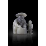 A BLACK AND WHITE FISHERMAN AND SON JADE GROUP 清代 黑白玉漁翁得利擺件 China, late Qing dynasty H.