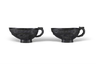 A PAIR OF ARCHAISTIC BRONZE CUPS WITH DRAGON HANDLES 清代 瑞獸紋龍柄銅杯一對 China, Qing dynasty L: