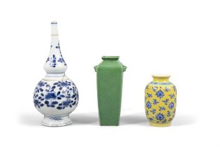 A SET OF THREE PORCELAINS, CONSISTING OF A BLUE AND WHITE GOURD VASE; A YELLOW GROUND BLUE AND