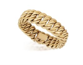 A GOLD BRACELET, the wide double-curb link bracelet with chiselled edges, mounted in 18K gold,