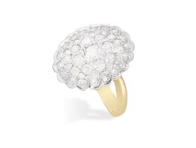 A DIAMOND DRESS RING, the bombé plaque within a scalloped border set with brilliant-cut diamonds