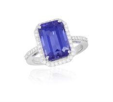 A TANZANITE AND DIAMOND RING, set with a rectangular-cut tanzanite weighing approximately 6.