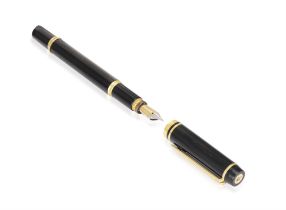 A FOUNTAIN PEN, BY WATERMAN, black coloured with gilt highlights, logo terminal, nib in 18K gold,