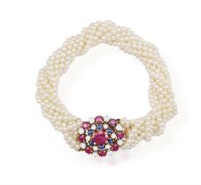 A RUBY, SAPPHIRE, CULTURED PEARL AND DIAMOND BRACELET, composed of nine strands of cultured pearls