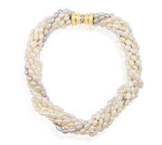 A FRESHWATER AND DIAMOND NECKLACE, composed of eight scrolled strands of fresh-water pearls of