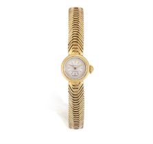 A LADY’S MECHANICAL GOLD WRISTWATCH, BY MOVADO, the circular cream dial with baton hour markers and