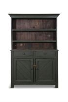 A GREEN PAINTED PINE DRESSER, the moulded cornice above two open shelves and plain slated back,