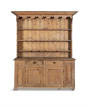 A 19TH CENTURY WELSH DRESSER, the top section with moulded canope cornice, above three shelves,