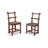 A PAIR OF PAINTED PINE CHAIRS with twin rail backs panel seats and square chamfered legs with