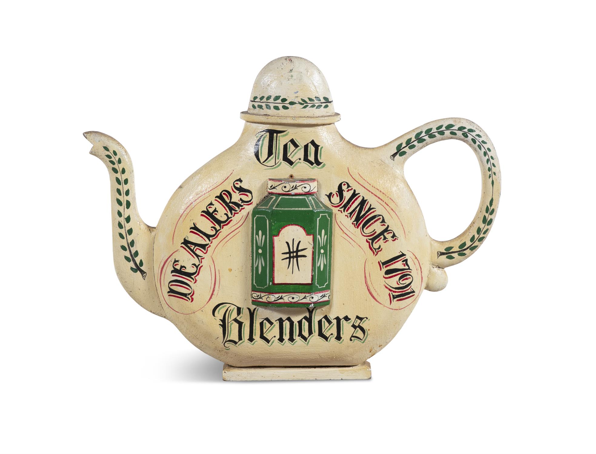 A PAINTED TIMBER SHOP SIGN IN THE FORM OF A TEAPOT, inscribed 'Tea Blenders - Dealers Since