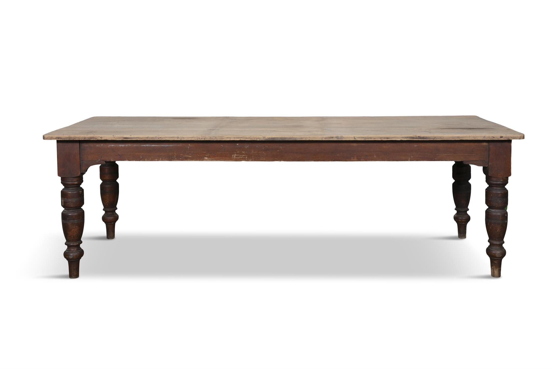 A LARGE 19TH CENTURY STAINED PINE KITCHEN TABLE WITH SYCAMORE TOP, the plain two panel top