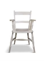 A WHITE PAINTED PINE CURVED RAILBACK CHAIR with scroll armrests, dished saddle seat on splayed