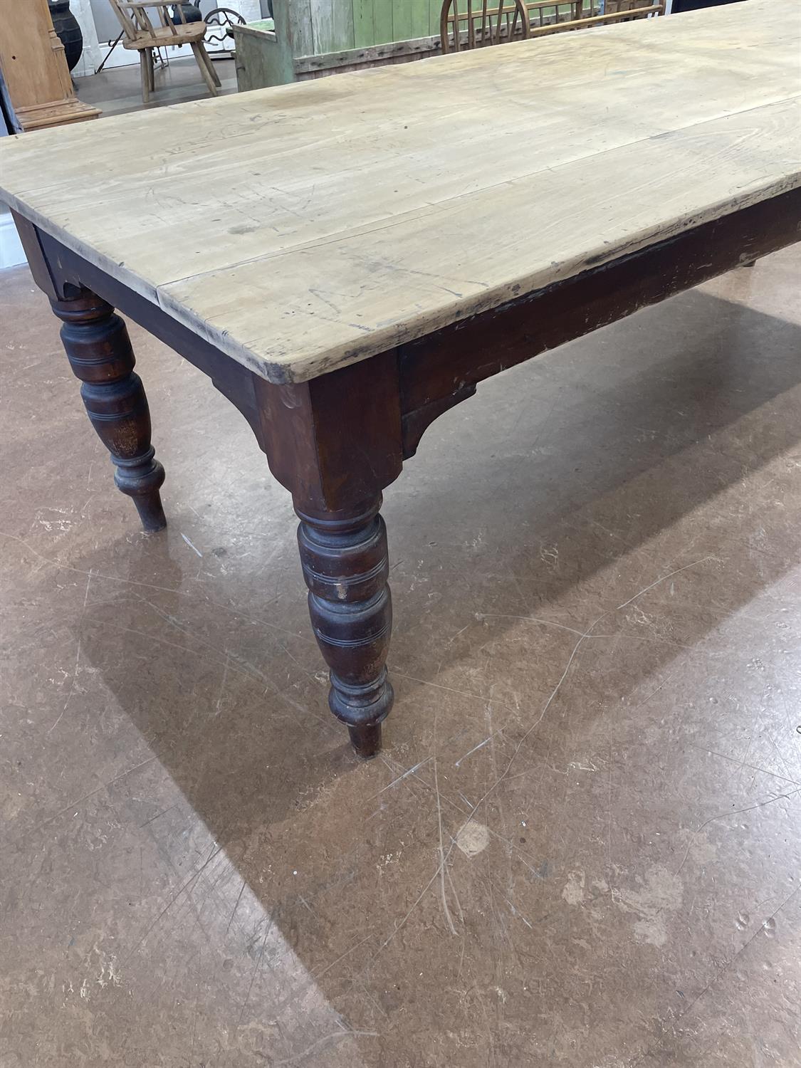 A LARGE 19TH CENTURY STAINED PINE KITCHEN TABLE WITH SYCAMORE TOP, the plain two panel top - Image 6 of 15