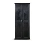 A BLACK PAINTED PINE CUPBOARD, with two twin panel doors, with turned white painted handles,