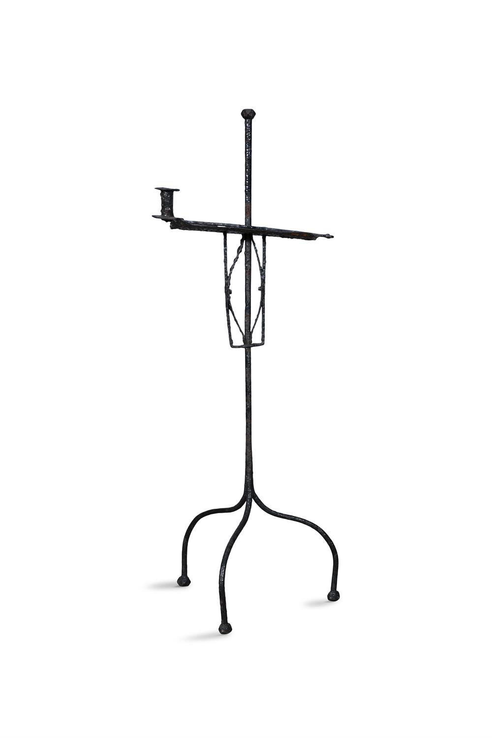 A WROUGHT IRON CANDLE STAND ON TRIPOD BASE, 109cm high