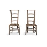 A PAIR OF 19TH CENTURY OLD PINE AND RUSH LADDER BACK LOW CHAIRS, 91cm high