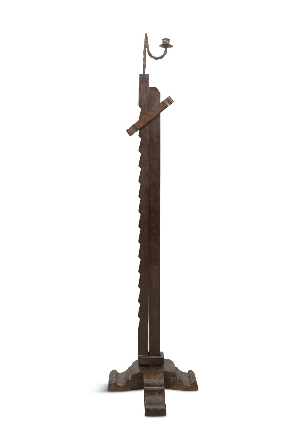 A IRON AND TIMBER ADJUSTABLE RUSH LIGHT, on X-framed base. 120.5cm high (not extended)