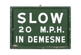 A GREEN AND WHITE PAINTED TIMBER SIGN 'SLOW 20 M.P.H., IN DEMENSE'. 45 X 65cm