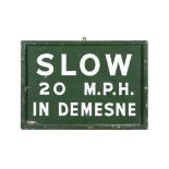 A GREEN AND WHITE PAINTED TIMBER SIGN 'SLOW 20 M.P.H., IN DEMENSE'. 45 X 65cm