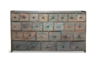 A VARIEGATED BLUE PAINTED PINE GERNERAL MERCHANT'S BANK OF TWENTY-SIX DRAWERS, the low gallery