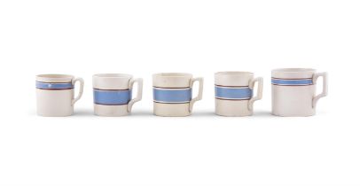FIVE CARRIGALINE POTTERY MUGS WITH BLUE BAND. the largest 9cm