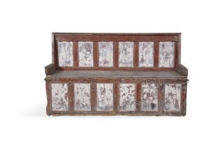 A 19TH CENTURY PAINTED PINE SETTLE BED, the moulded top and shaped frieze above the six panel