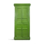 A 19TH CENTURY GREEN PAINTED CUBOARD the dentil cornice over twin four panel enclosing fitted