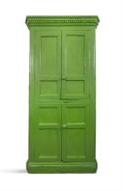 A 19TH CENTURY GREEN PAINTED CUBOARD the dentil cornice over twin four panel enclosing fitted