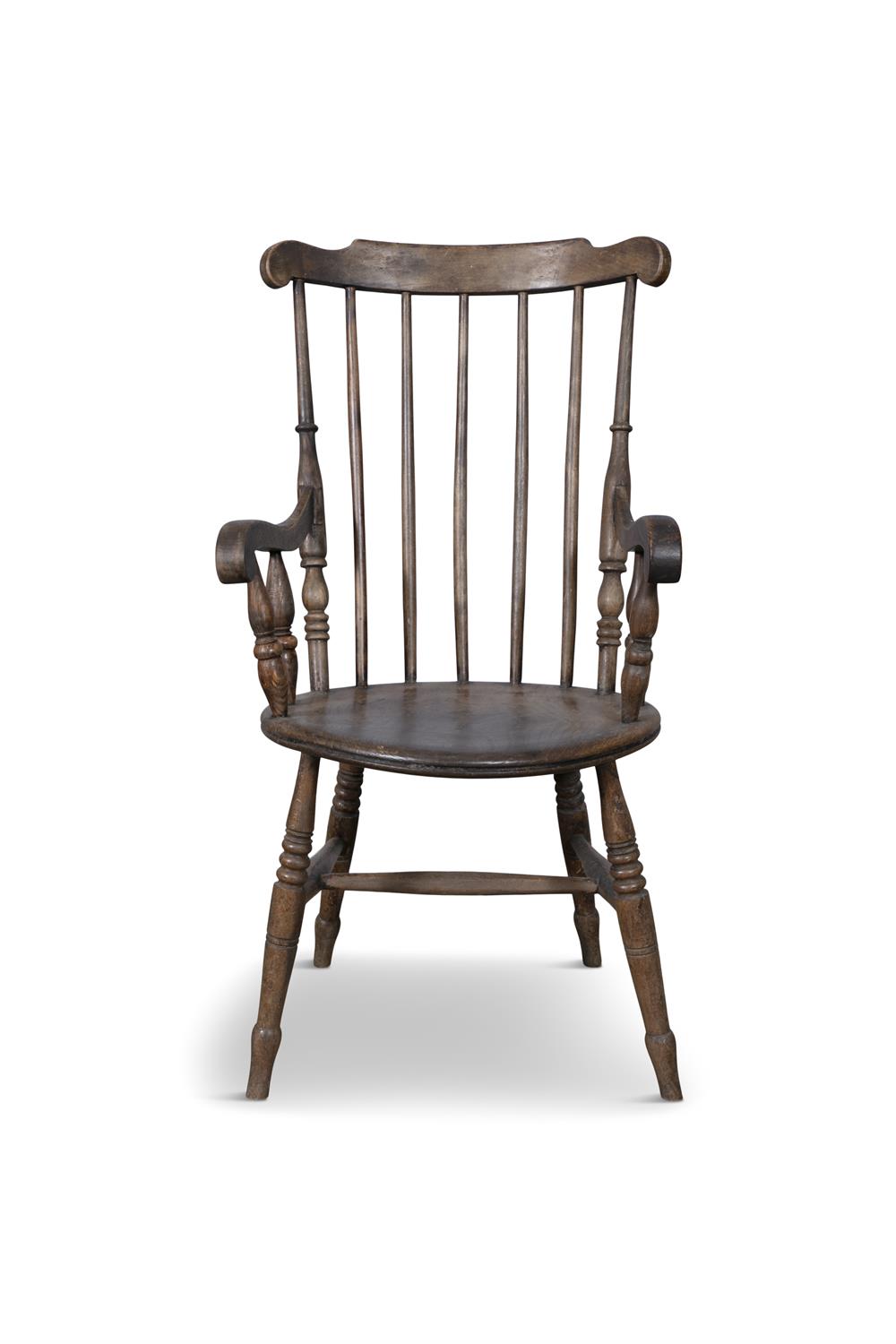 A TRADITIONAL PATTERN WINDSOR STYLE CHAIR with carved spindle back and circular panel seat on