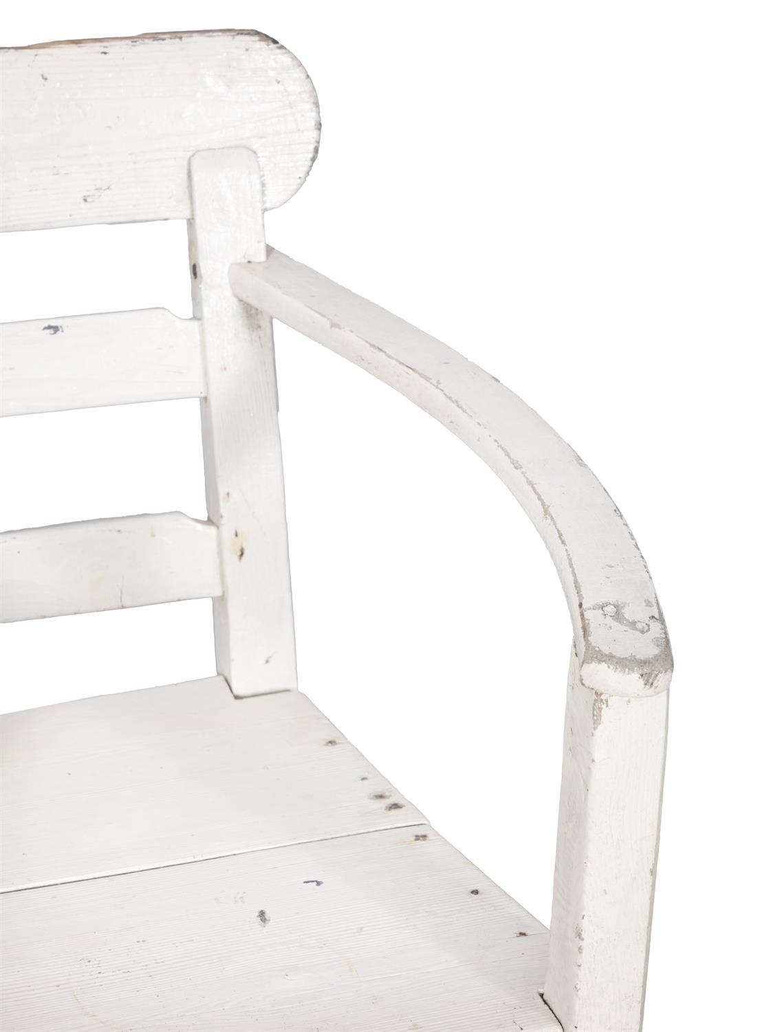 A WHITE PAINTED PINE ARCMCHAIR with ladder back and slightly bowed armrests, panelled seat and - Bild 3 aus 3