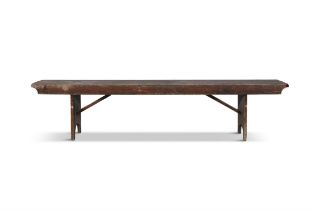 A 19TH CENTURY STAINED LONG BENCH, with plain seat above a shaped frieze with trestle feet and