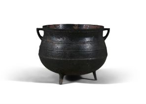 A EARLY 19TH CENTURY LARGE CAST IRON POT, of circular bulbous form, with out-turned rim,