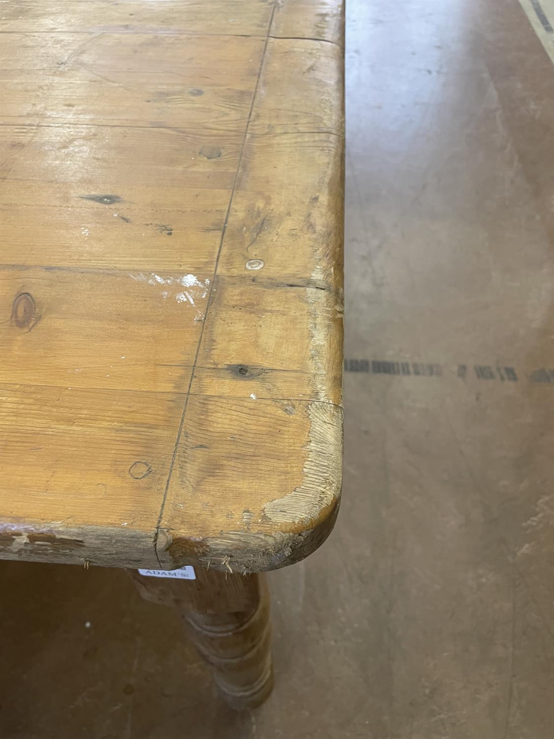 A LARGE PINE RECTANGULAR FARMHOUSE TABLE, LATE 19TH CENTURY, on turned tapering legs. - Image 7 of 10