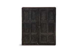 A STAINED PINE HANGING CUPBOARD, of rectangular form the twin fielded panel doors with six