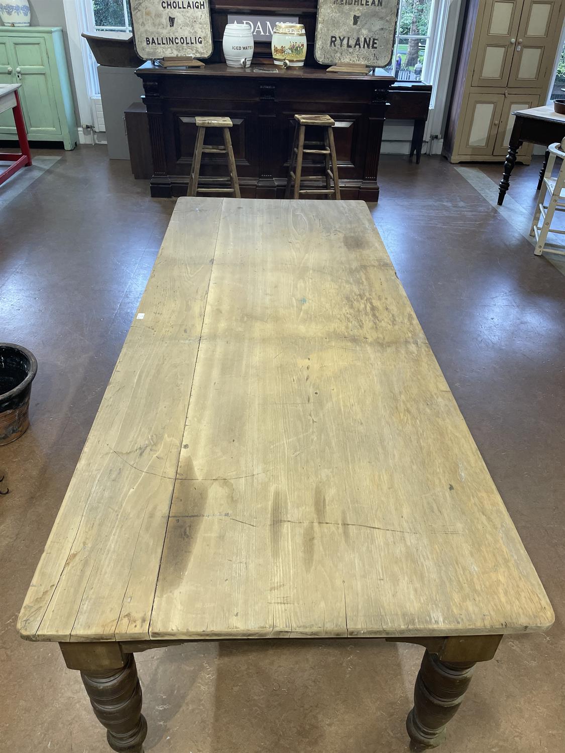 A LARGE 19TH CENTURY STAINED PINE KITCHEN TABLE WITH SYCAMORE TOP, the plain two panel top - Image 13 of 15