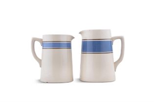 TWO CARRIGALINE POTTERY JUGS, BLUE BAND. 17cm wide