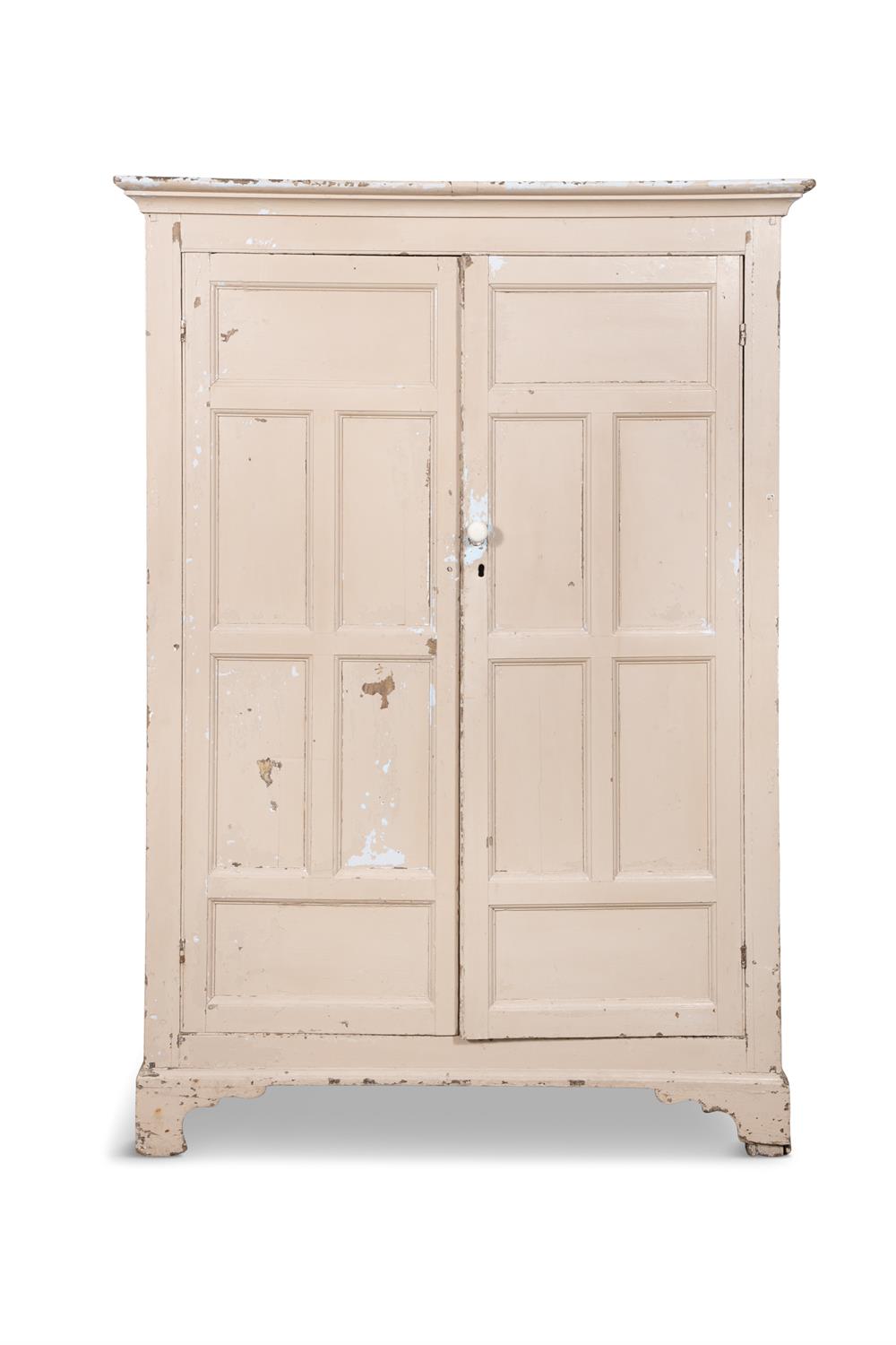 AN EARLY 19TH CENTURY WHITE PAINTED PINE CABINET the moulded cornice above two long cupboard