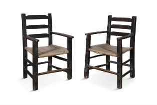 A PAINTED BLACK SUGAN CHAIRS with ladder back and sugan seat on square supports with stretcher.
