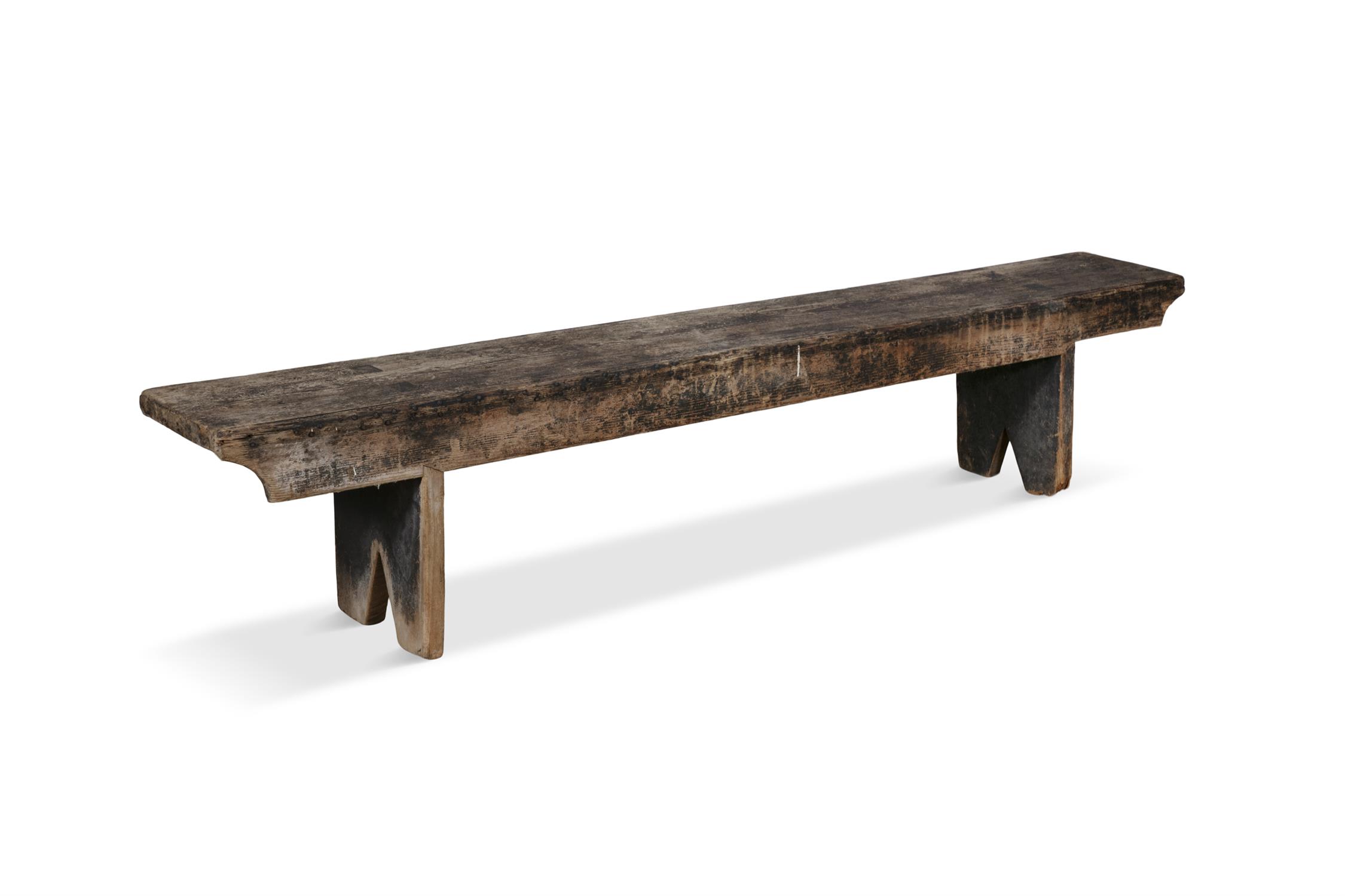 A 19TH CENTURY STAINED LONG BENCH, with plain seat above a shaped frieze with trestle feet. - Image 2 of 3