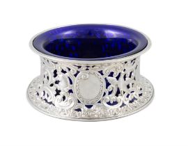 A VICTORIAN SILVER DISH RING London, c.1895, mark of Pairpoint Brothers, with blue glass