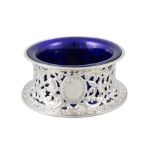 A VICTORIAN SILVER DISH RING London, c.1895, mark of Pairpoint Brothers, with blue glass