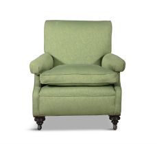 AN UPHOLSTERED MAHOGANY FRAMED EASY ARMCHAIR, ATTRIBUTED TO HOWARD & WILLOUGHBY covered in a