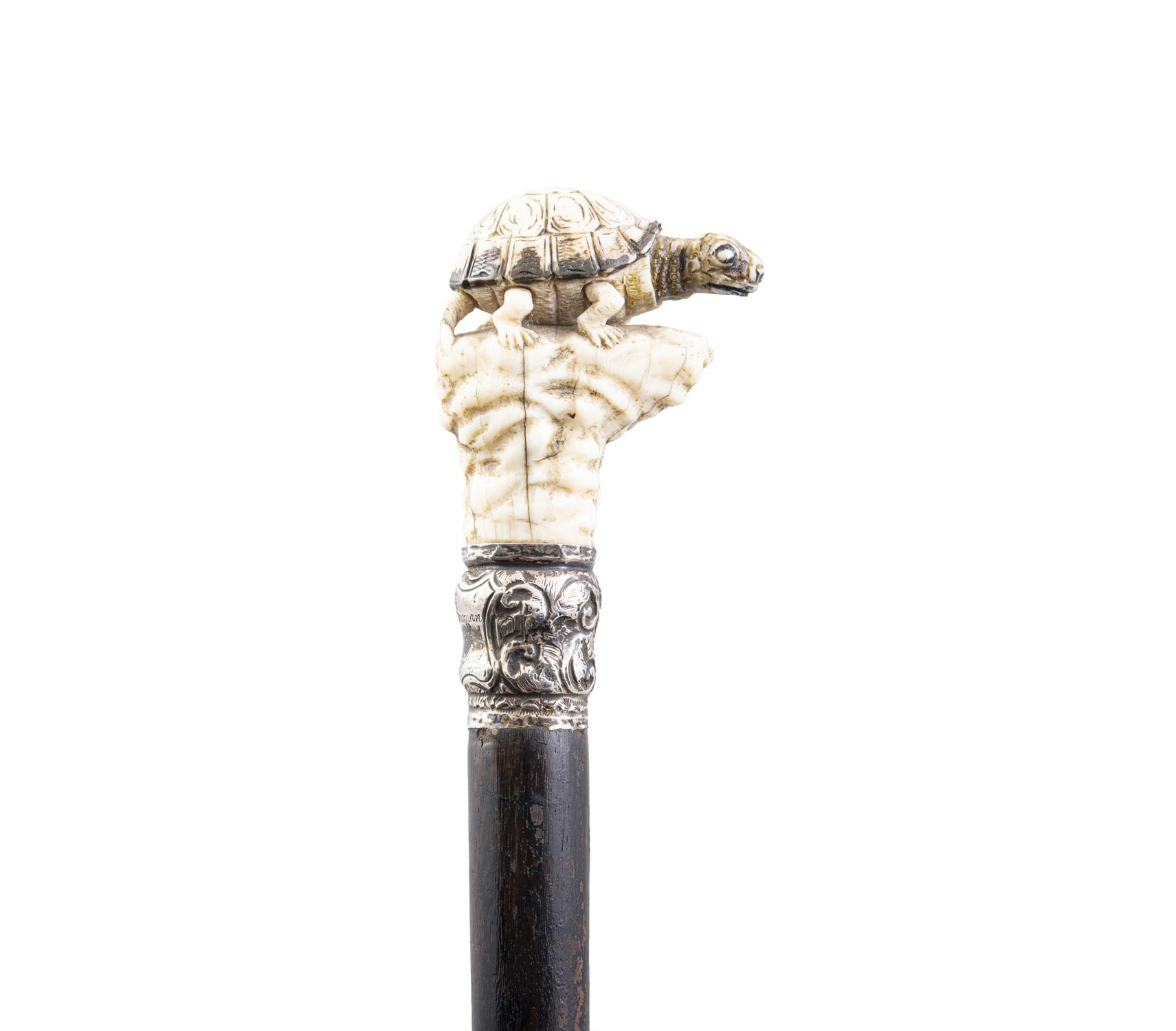 *A WALKING CANE, with a carved bone handle in the of a turtle perched on a rock above a white - Image 2 of 4