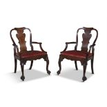A PAIR OF GEORGE III CARVED OAK PROVINCIAL ARMCHAIRS, each with wavy vase shaped splat,
