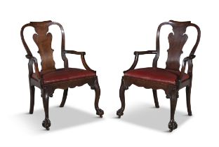 A PAIR OF GEORGE III CARVED OAK PROVINCIAL ARMCHAIRS, each with wavy vase shaped splat,