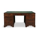 A GEORGE III TWIN PEDESTAL PARTNER'S DESK the rectangular top with faded green leather writing