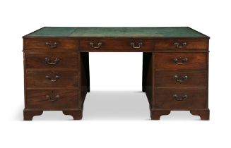 A GEORGE III TWIN PEDESTAL PARTNER'S DESK the rectangular top with faded green leather writing